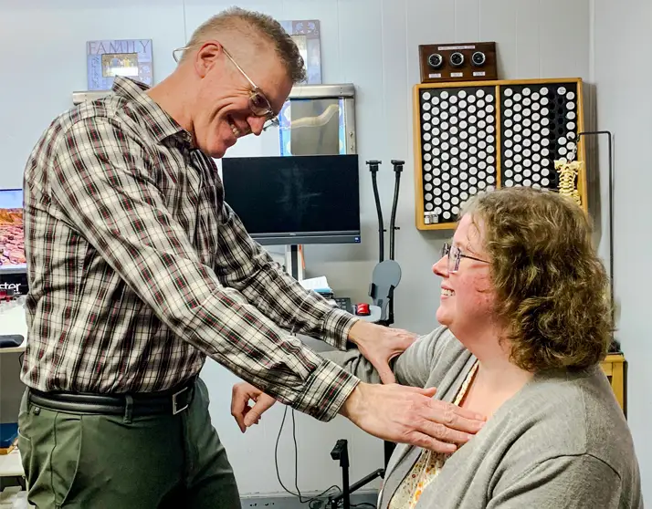 Dr. Phillips muscle testing a female patient